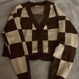 • brown & cream colored button up cardigan